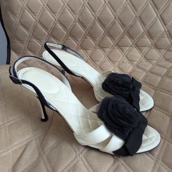 CHANEL Shoes - CHANEL Camellia Black Bow Ivory Leather Heels Shoes Slide Slingback Sandals